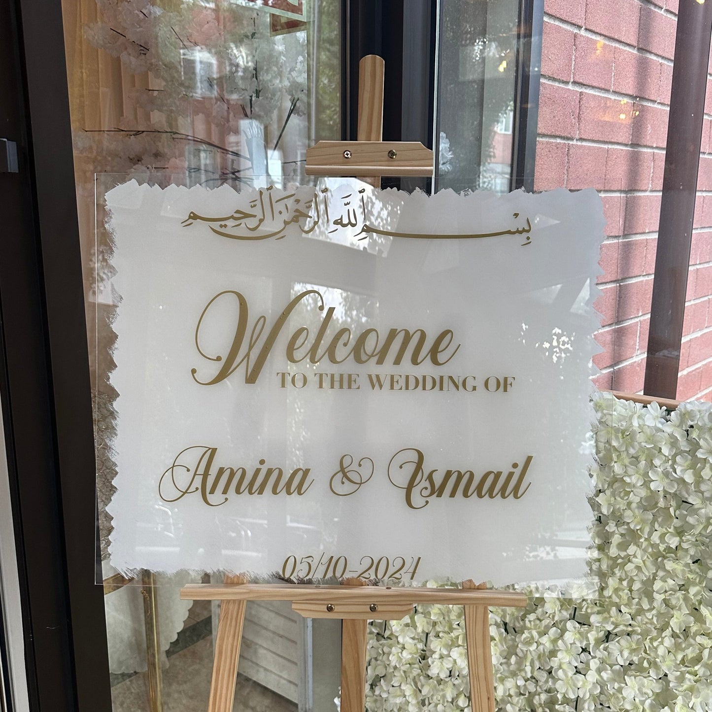 Skylt - "welcome to the wedding of"