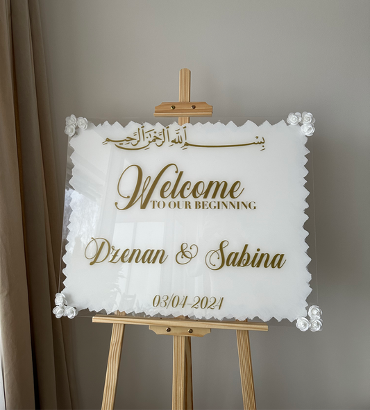 Skylt - "Welcome to our beginning"